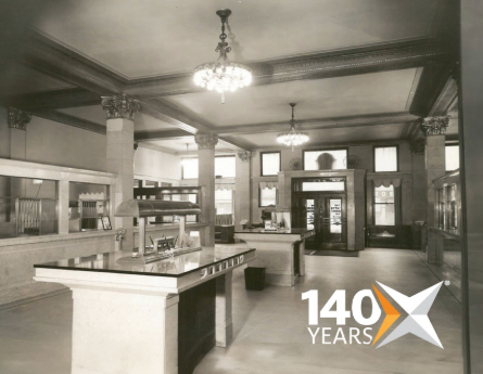 Black and white image of the inside Civista Bank lobby with 140-year anniversary graphic in corner.