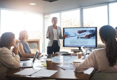 Person presenting to their team.